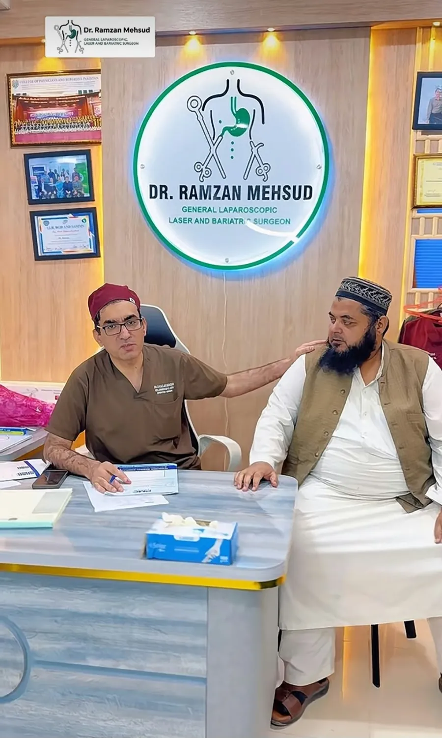 Dr. Ramzan with a patient during a clinic consultation