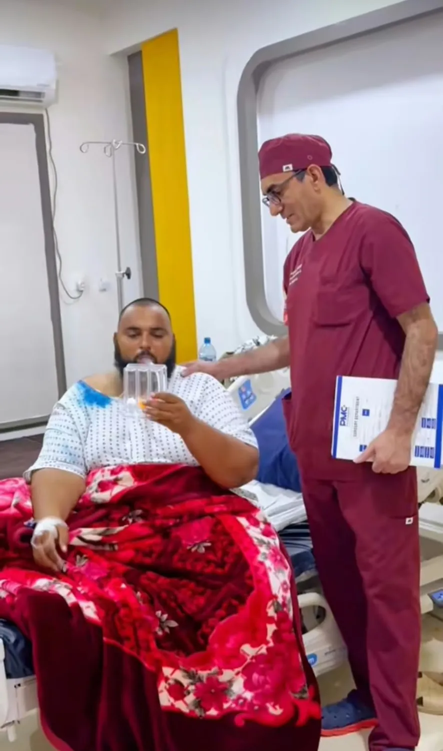 Dr. Ramzan checking on a patient recovering in hospital
